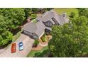 Gorgeous home featuring mature landscaping, three-car garage and stunning curb appeal from above at 922 Florence Rd, Douglasville, GA 30134