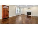 Bright living room with hardwood floors, fireplace, and large windows at 1492 Frazier Rd, Decatur, GA 30033