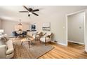 Bright living room featuring hardwood floors, neutral tones, and a ceiling fan at 2685 Harrington Dr, Decatur, GA 30033