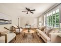Comfortable living room with hardwood floors, stylish furniture, and large windows at 2685 Harrington Dr, Decatur, GA 30033