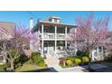 Beautiful two story home with inviting double porches and manicured landscaping at 94 Hogue Ne St, Atlanta, GA 30312