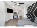 Open living space with modern kitchen, comfortable seating, and contemporary black and white wall design at 215 Piedmont Ne Ave # 2210, Atlanta, GA 30308