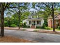 Beautifully landscaped two-story home with a welcoming front porch, ideal for relaxing and enjoying the neighborhood at 5134 Pratt Sw St, Covington, GA 30014