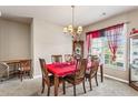 Bright dining room with a chandelier, large window, and ample seating for Gathering gatherings at 635 Crosswinds Cir, Marietta, GA 30008