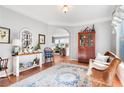 Inviting living room with hardwood floors, a decorative rug, and stylish furnishings at 233 Hampton Station Blvd, Canton, GA 30115