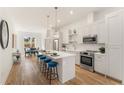 Bright, modern kitchen with white cabinets, stainless steel appliances, and eat-in island at 1237 Memorial Se Dr # 402, Atlanta, GA 30316