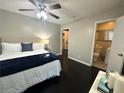 Comfortable bedroom suite with a modern bed frame, decorative pillows, and an ensuite bathroom with great features at 1900 Meadow Ln, Decatur, GA 30032