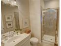 Bathroom featuring modern shower and vanity, accented with decorative art at 14 Lochurst Ln # 153, Roswell, GA 30076