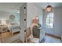 Bright bedroom view showcases a neutral palette and adjacent hall decor at 14 Lochurst Ln # 153, Roswell, GA 30076