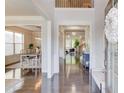 Inviting foyer with hardwood floors, open layout, and views into dining and living areas at 3049 Ivy Crossing Dr, Buford, GA 30519
