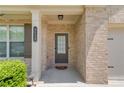 Close-up of front door with brick facade and decorative house number at 3049 Ivy Crossing Dr, Buford, GA 30519