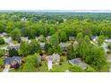 Aerial view of neighborhood showcasing mature trees, lush landscaping, and well-maintained homes at 230 Bristolstone Ct, Alpharetta, GA 30005
