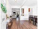 Warm and welcoming foyer featuring wood floors and an open view of the living and dining areas at 3303 Timbercreek Cir, Roswell, GA 30076