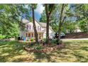 Lovely two-story home with a welcoming front porch and a two-car garage at 745 Beaver Pond Trl, Fairburn, GA 30213