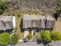 Overhead view of townhomes with gray shingles, two-car garages, and manicured lawns at 2293 Baker Station Dr, Acworth, GA 30101