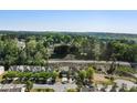 Scenic aerial view of a residential community surrounded by lush greenery and trees at 2293 Baker Station Dr, Acworth, GA 30101