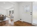 Bright foyer with hardwood floors and decorative glass door leading to the living area at 335 Amberidge Trl, Atlanta, GA 30328