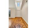 Elegant foyer with decorative hardwood floors, high ceilings, and a welcoming front door at 5410 Lenox Park Pl, Buford, GA 30518