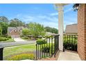Street view from the front porch, showcasing a well-manicured lawn and landscaped surroundings at 5870 Buckner Creek Dr, Mableton, GA 30126
