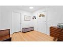 Bright foyer with hardwood floors, a front door with a decorative window, and white walls at 1866 Wildwood Ne Pl, Atlanta, GA 30324