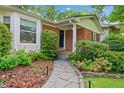 Inviting front entrance with a stone pathway leading to a classic brick home at 1866 Wildwood Ne Pl, Atlanta, GA 30324