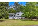 Inviting two-story home featuring a well-maintained lawn and cozy front porch at 2994 Cathy Ann Nw Ct, Acworth, GA 30101