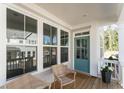 Inviting front porch featuring neutral decor, wicker chairs, and ample natural light at 919 East Green Ln, Clarkston, GA 30021