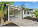 Spacious covered carport with access to the home, and black trim at 130 Oakcliff Court, Atlanta, GA 30331