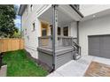 Picture of a quaint front porch with gray railings and a bright yellow front door at 779-B Lynwood Se St, Atlanta, GA 30312