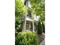 Charming two-story home with a cozy front porch and well-manicured landscaping in a suburban neighborhood at 986 Mauldin Se St, Atlanta, GA 30316