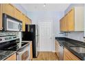 Efficient kitchen with stainless steel appliances, granite countertops, and ample cabinet space at 1150 Collier Nw Rd # 1N, Atlanta, GA 30318
