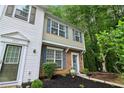 Attractive townhouse exterior with brick accents, blue shutters, and landscaped front yard at 3618 Berkeley Ct # Iv-A, Duluth, GA 30096
