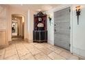 Grand entryway featuring stone floors, custom storage, and ornate sconces at 147 15Th Ne St # 16C, Atlanta, GA 30309