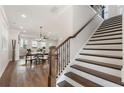 Bright open concept living room and staircase, perfect for gatherings and everyday comfort at 3747 Silvery Way, Powder Springs, GA 30127