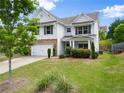 Well-maintained home with a lush lawn, a two-car garage, and charming curb appeal at 3940 Village Estates Ct, Cumming, GA 30040
