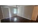 Cozy living room with hardwood floors, ceiling fan, and a door leading to the outside at 4185 Brookwood Dr, Austell, GA 30106
