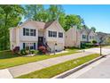 Attractive home with a well-maintained lawn, flower beds, double garage, and inviting front entrance at 1010 Augusta Woods Dr, Douglasville, GA 30134