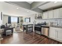 Inviting living room featuring hardwood floors, modern furniture, and an open layout with abundant natural light at 215 Piedmont # 1804, Atlanta, GA 30308