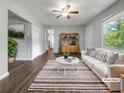 Staged living room featuring stylish furniture, ceiling fan, neutral paint and lots of natural light at 233 Banberry Se Dr, Atlanta, GA 30315
