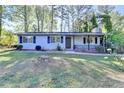 Lovely one-level home with neat landscaping and a cozy, covered entrance at 1824 Guardian Way, Lawrenceville, GA 30043