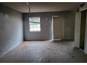 Empty bedroom with hardwood floors and a window at 4701 Flat Shoals Rd # 56D, Union City, GA 30291