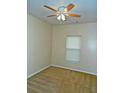 Bright bedroom featuring neutral walls, carpet flooring, and a ceiling fan at 207 Brownlee Sw Rd, Atlanta, GA 30331