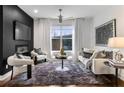Bright living room with a cozy seating area, plush rug, and large window at 2498 Perry Nw Blvd, Atlanta, GA 30318