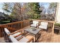 Relaxing back deck perfect for entertaining, featuring comfortable seating and wooded views at 2725 Monet Dr, Cumming, GA 30041