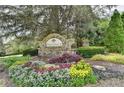 Welcoming entrance to Provence featuring lush landscaping and stone community sign at 2725 Monet Dr, Cumming, GA 30041