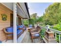 Cozy covered porch with comfortable wicker furniture, perfect for relaxing and enjoying the outdoors at 4364 Saddlecreek Ct, Auburn, GA 30011