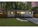 Charming exterior view of home featuring a well-manicured lawn and driveway at 2392 Jefferson Ter, Atlanta, GA 30344
