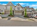 View of townhouses with well-maintained lawns and driveways, showcasing the neighborhood's curb appeal at 409 Retreat Ln, Canton, GA 30114