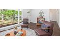 Well-lit living room featuring hardwood floors, stylish decor, and a large window at 331 Zelma Sw St, Marietta, GA 30060