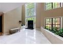 Bright and airy lobby with high ceilings, marble floors, and a large window at 27306 Plantation Ne Dr, Atlanta, GA 30324
